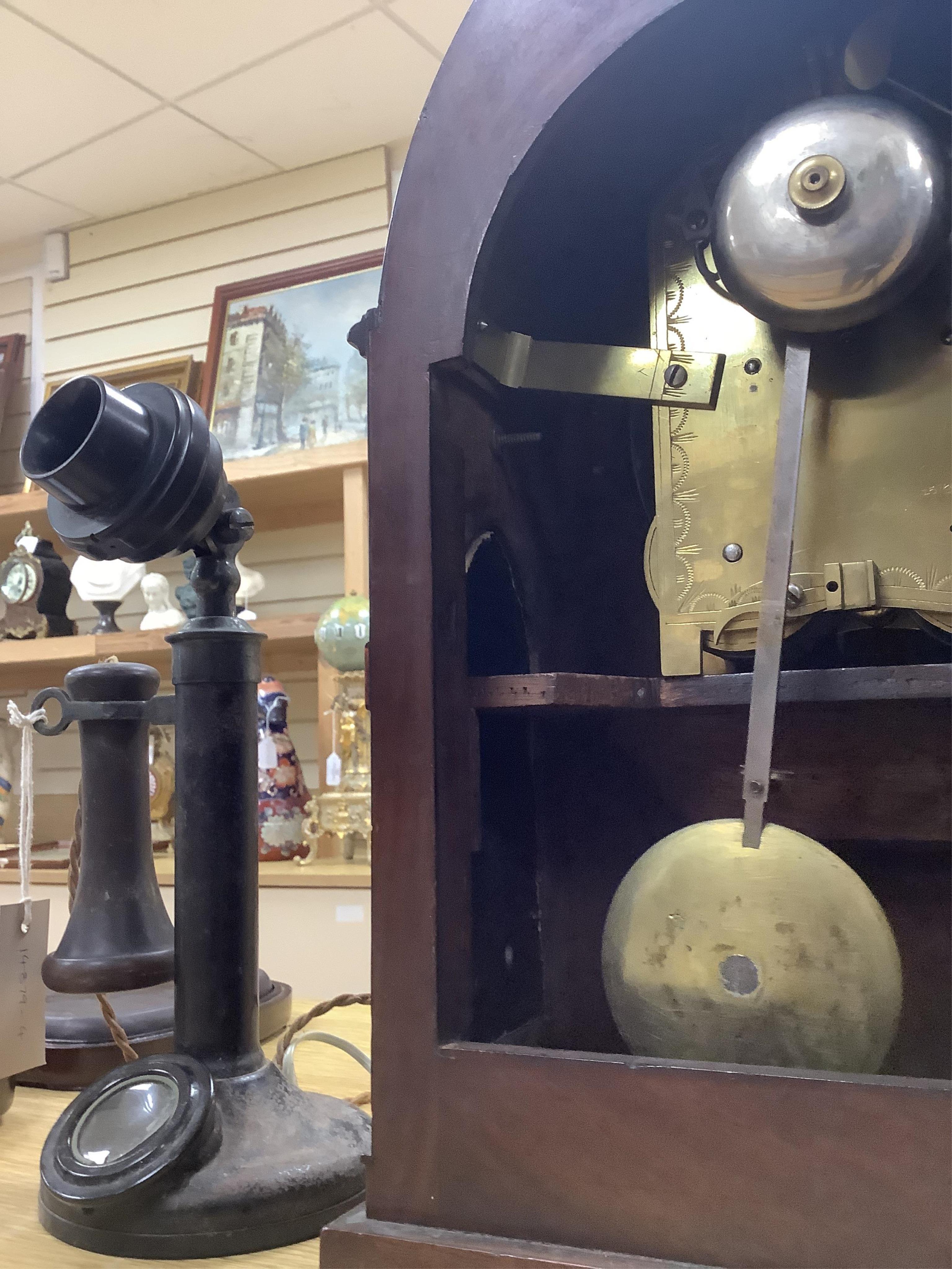 An early 19th century brass inlaid mahogany lancet shaped mantel clock by G. Willson of London, with pendulum and door-key, no winding key, 45cm. Condition - fair to good, not tested as working